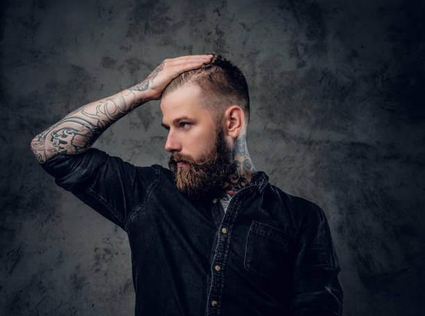 istock Bearded male  holding hands on his head. 918173214