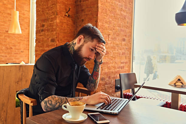 istock A man relaxing at the table after work with a laptop. 918173598