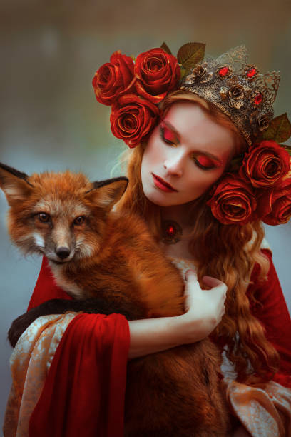 istock Woman in medieval clothes with a fox 918177156