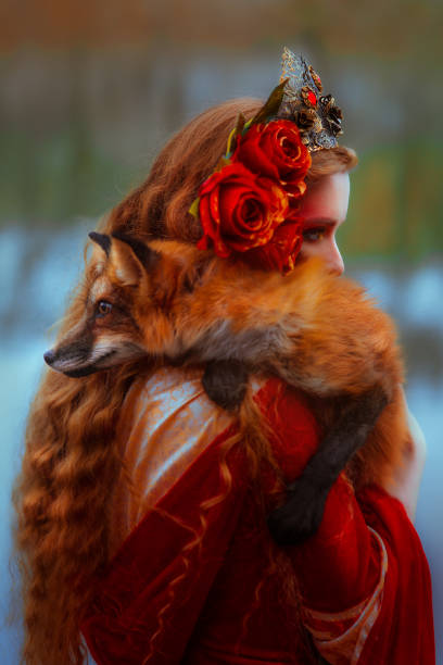 istock Woman in medieval clothes with a fox 918179462
