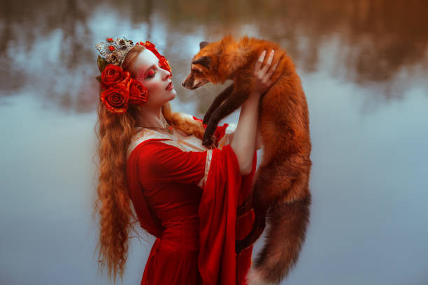 istock Woman in medieval clothes with a fox 918179598