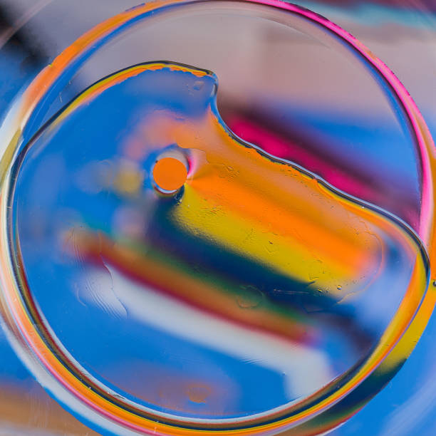 istock Oil on water - abstract macro background. 918179608