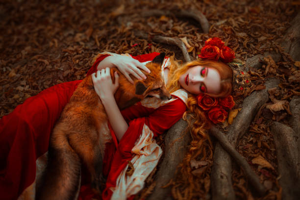 istock Woman in medieval clothes with a fox 918179698