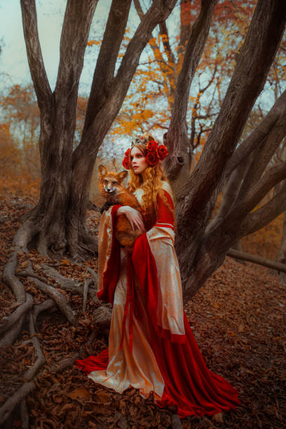 istock Woman in medieval clothes with a fox 918179850