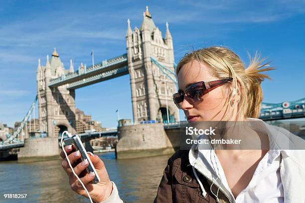 Cool Beautiful Young Woman Listening To Her Ipod In London Stock Photo - Download Image Now