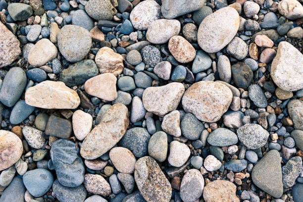 Stones, pebbles and sand on the shore of a mountain river