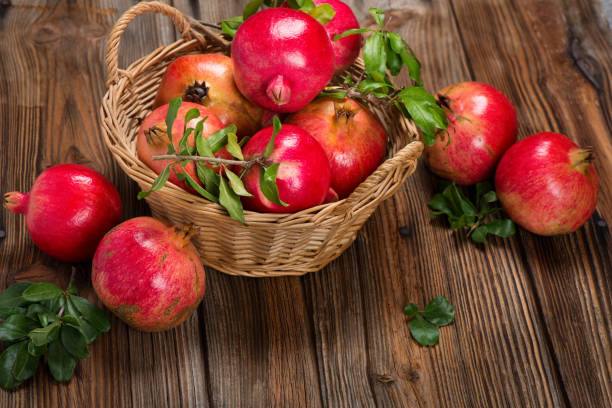 istock Organic pomegranate fruits with twigs. 918184958
