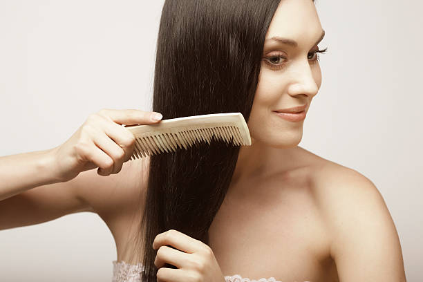 istock girl combs hair 91818675
