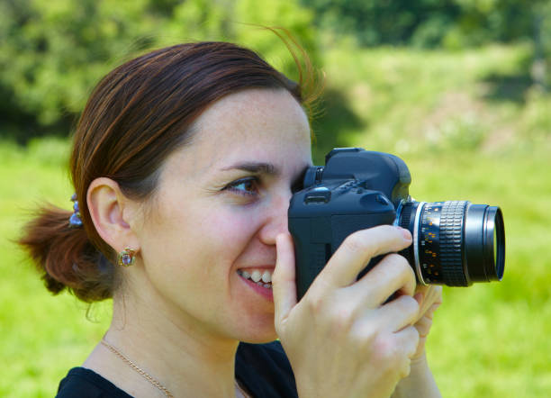 istock Woman photographer with camera 918187322