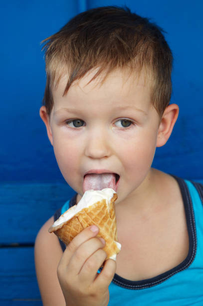 istock Little boy eating ice cream 918187432