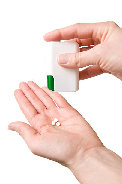 istock Pills in the woman hands - Isolated on White 91818763