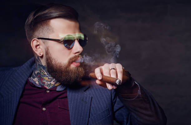 istock A man in sunglasses smoking a cigar. 918188528