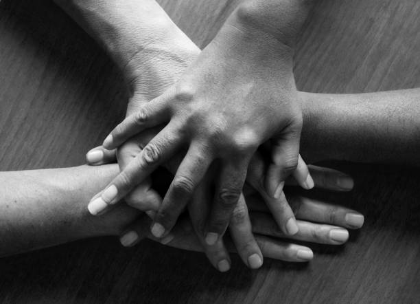 istock two caucasian and asian 50 year old womens hand 918194954