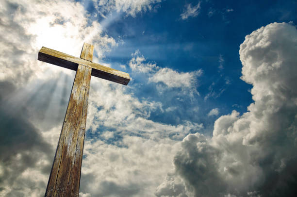 istock Cross against the sky. Happy Easter. Christian symbol 918195924