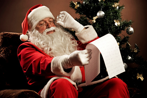 Traditional Santa Claus reading a letter. See more Santa's photos (XXXL size) in my lightbox \