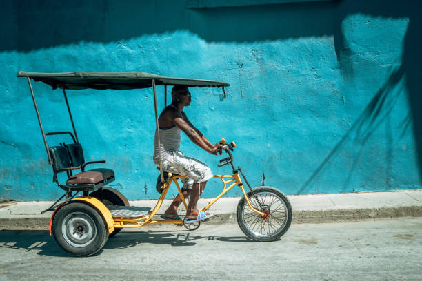 istock Bicycle taxi driver with his vehicle, Cuba 918200594