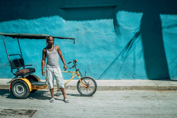 istock Bicycle taxi driver with his vehicle, Cuba 918200842