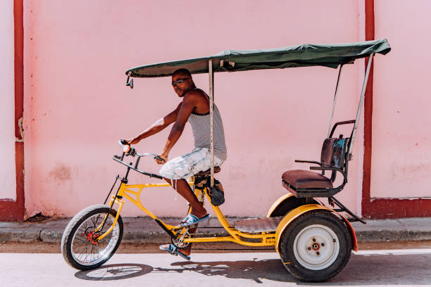 istock Bicycle taxi driver with his vehicle, Cuba 918201032
