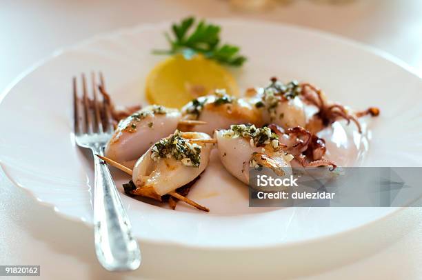 Closeup Of Cooked Squid Served On White Plate Stock Photo - Download Image Now - Cheese, Color Image, Dinner