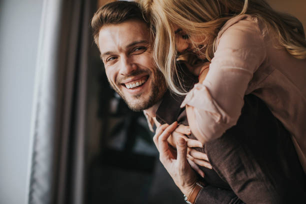 istock Young man carrying young woman on his back 918201804