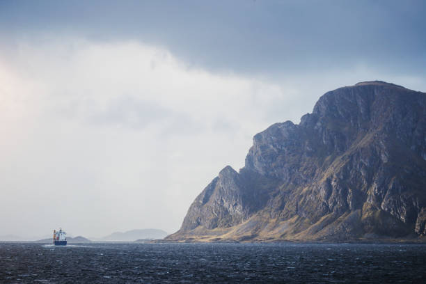 Cargo boat sailing in a fjord