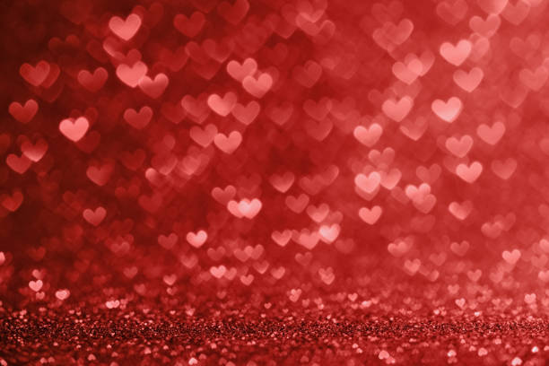 istock Defocused lights in the shape of red hearts 918205700