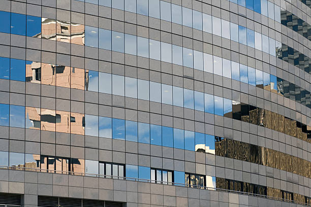 istock Reflections in the glass wall of a building 91821193