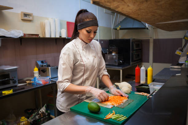 istock a girl prepares food sushi 918215542