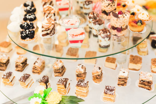 istock Delicious sweets on wedding candy buffet with desserts, cupcakes 918215614