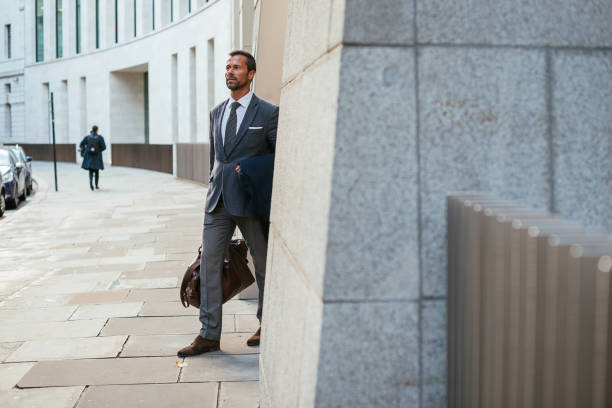 istock Businessman leaving luxury hotel with the suitcase 918218768