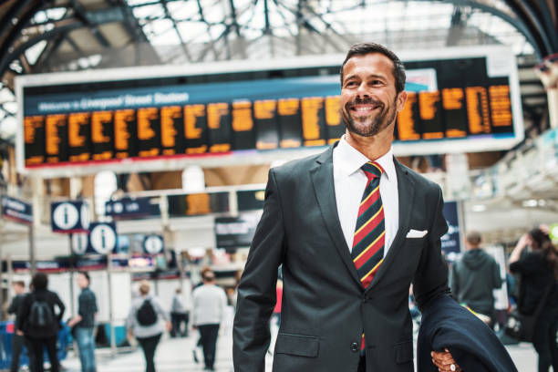 istock Cheerful business person in full suit going to work 918221918