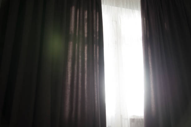 istock sunshine trough window with curtains 918221934