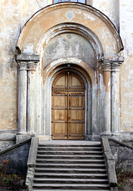 Nouméa, South Province, Grande Terre, New Caledonia: Catholic Cathedral of Saint Joseph - built using prison labor, according to the plans of a former convict, a certain Labulle. Neo-Gothic gate with stone archivolts using voussoirs, supported by five jambs on each side.