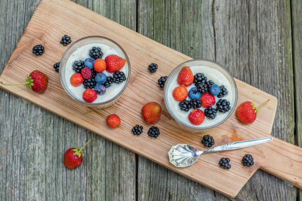 istock Top view on homemade vanilla pudding with raspberries and blackberries and blueberries 918228486