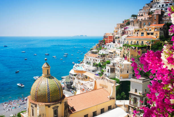 Positano resort, Italy view of Positano with flowers - famous old italian resort, Italy amalfi photos stock pictures, royalty-free photos & images