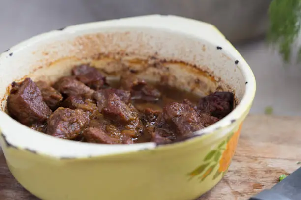 stewed beef in a saucepan on a table