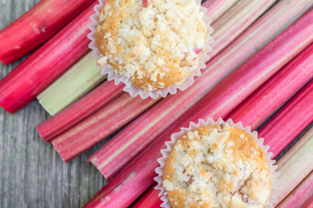Detailed Top View on two Rhubarb muffins on a rhubarb perioles stock photo