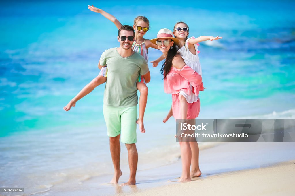 Young family on vacation have a lot of fun together Young family on vacation have a lot of fun Family Stock Photo