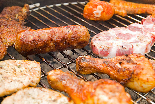 istock Sausages, beef and other meat on a barbecue 91823761