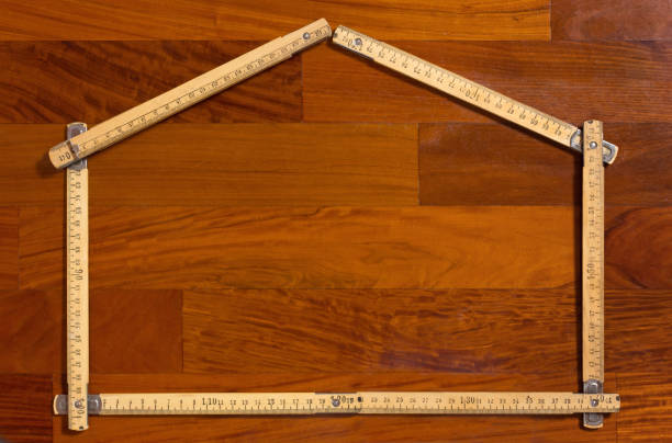 istock House Shaped Folded Measuring Stick on Wooden Background 918244824