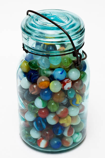 istock A full jar of multicolored marbles on a white background 91824596