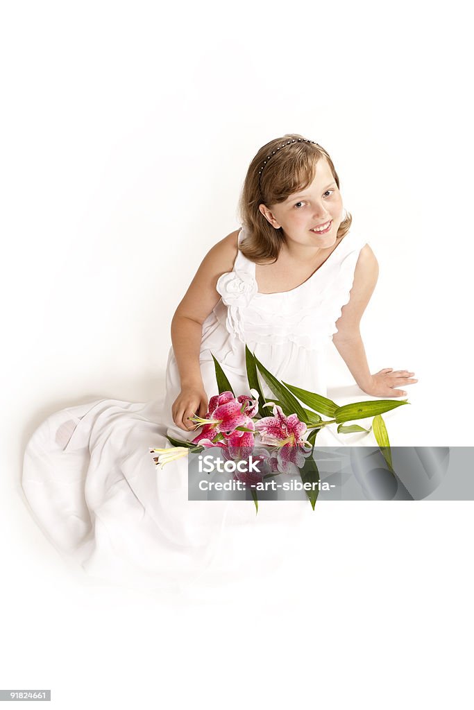 La ragazza e un fiore - Foto stock royalty-free di Adolescente