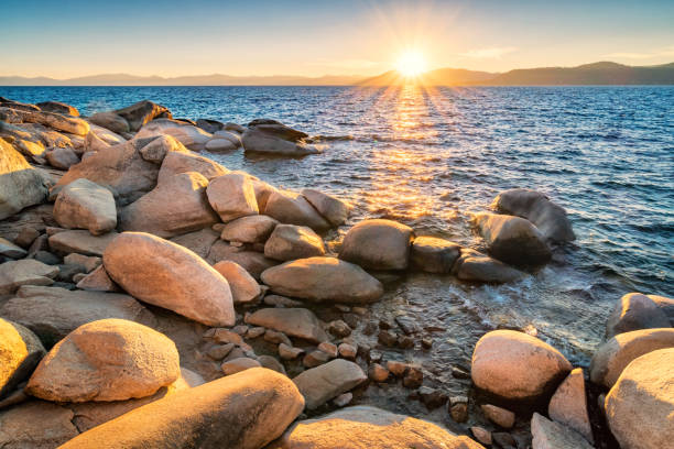 Sunset at Lake Tahoe USA Stock photograph of the stony shores of Lake Tahoe, as seen from the Nevada side, USA at sunset. waters edge stock pictures, royalty-free photos & images