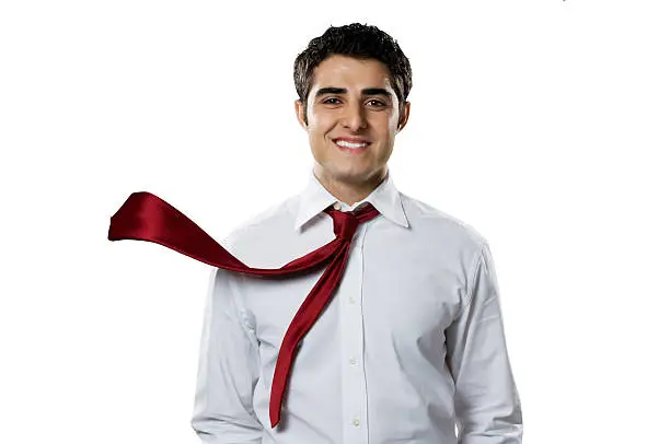 Photo of A businessman in a white shirt and red tie