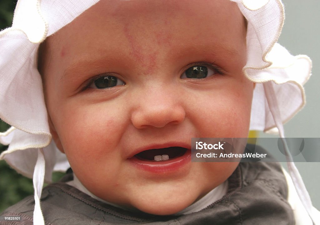 Small Girl with two teeth  Beautiful People Stock Photo