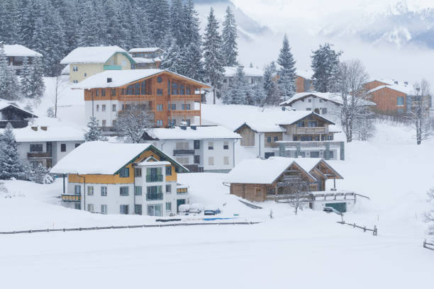 istock snowing in snow covered winter village 918251050