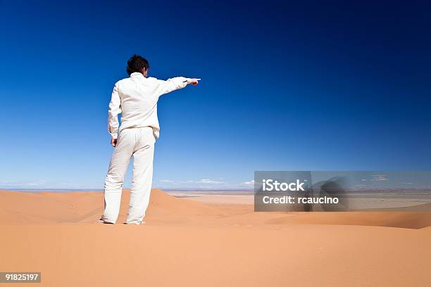 Man Standing On A Sand Dune Stock Photo - Download Image Now - Adult, Adults Only, Africa