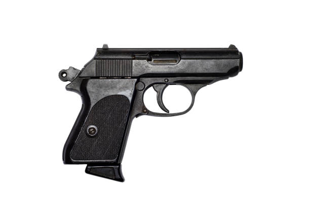 istock Used black metal pistol gun on white background 918252264