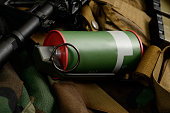 Smoke grenade with military equipment.