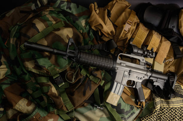 istock Assault rifle, pistol, grenade with tactical chest rigs and ammunition. 918254834